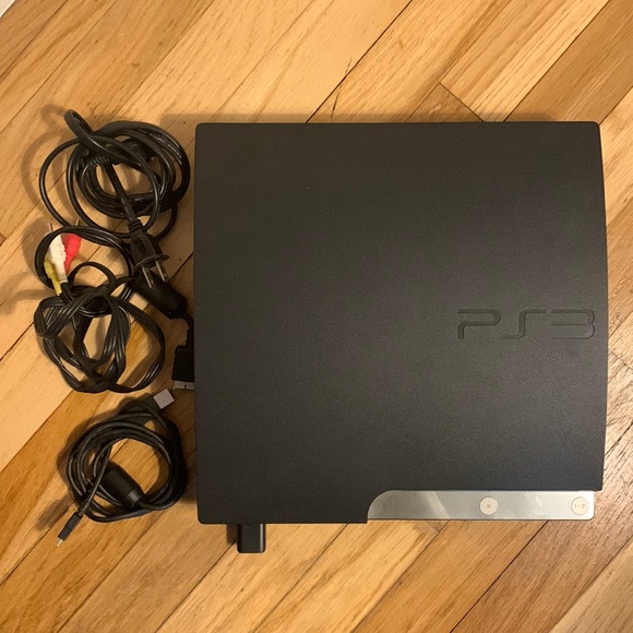 Play Station 3 with 4 controllers and charging station - hardly used